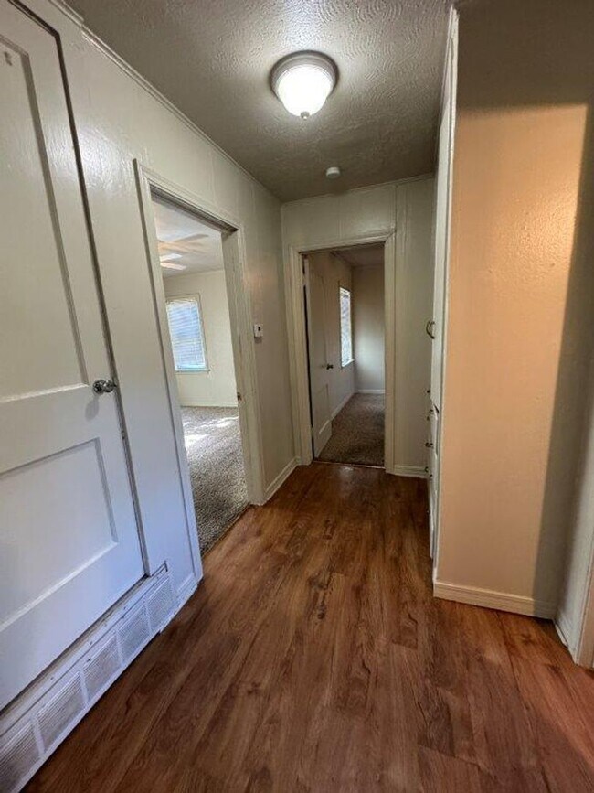Building Photo - Mowing Included!  Lots of character, wood vinyl flooring and carpet, large, fenced yard, ready fo...