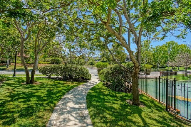 Building Photo - PRIME POOLFRONT LOCATION & CLOSE TO MAIN GATE! BRIGHT & SPACIOUS, END-UNIT POOLFRONT TOWNHOUSE W/...