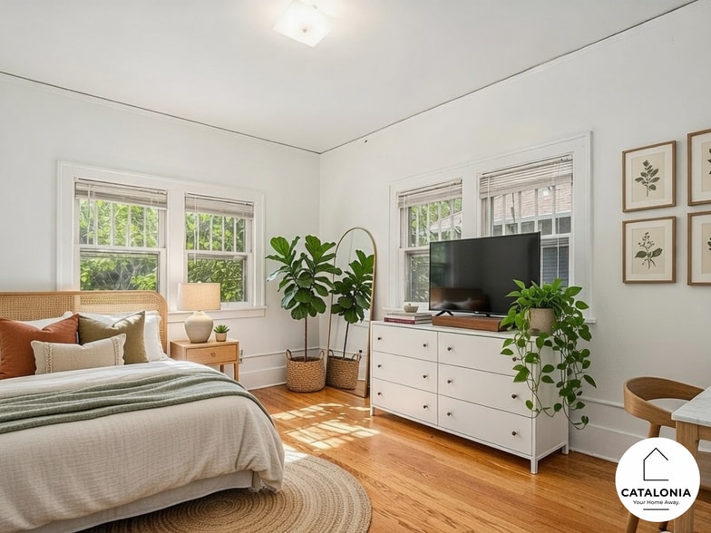 Bedroom 1 of 6 with natural light and large closet. - 2025 8th Ave