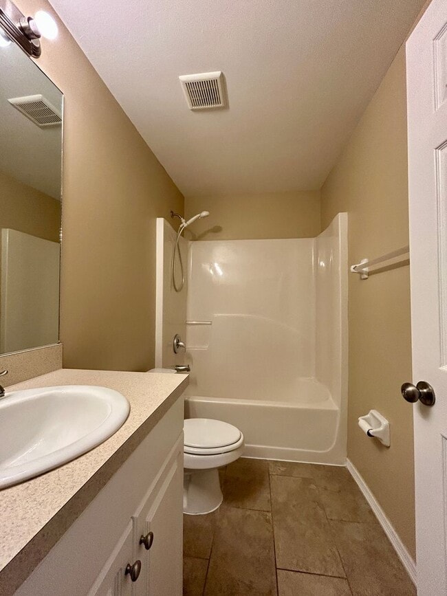 Building Photo - Charming 3BR/2BA Lehigh Acres Duplex with 1-Car Garage | Lawn Care & Salt Service Included