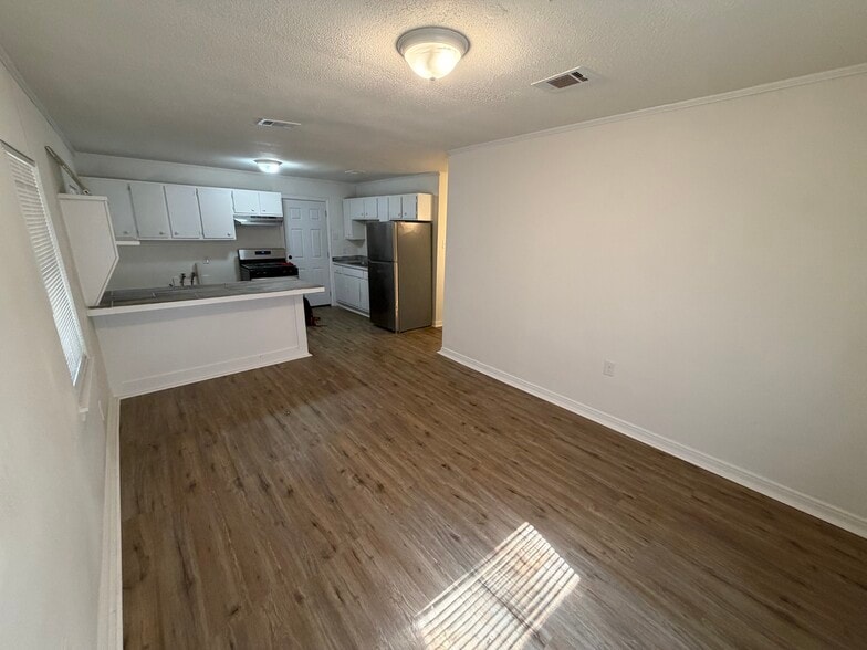 Living room into kitchen - 114 Rosewood Dr