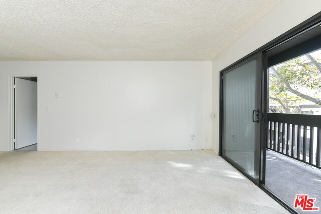 Living room and balcony - 7742 Redlands St