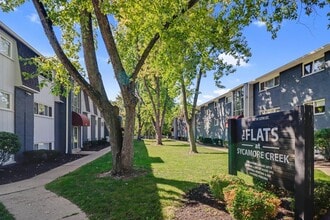 Building Photo - The Flats at Sycamore Trails