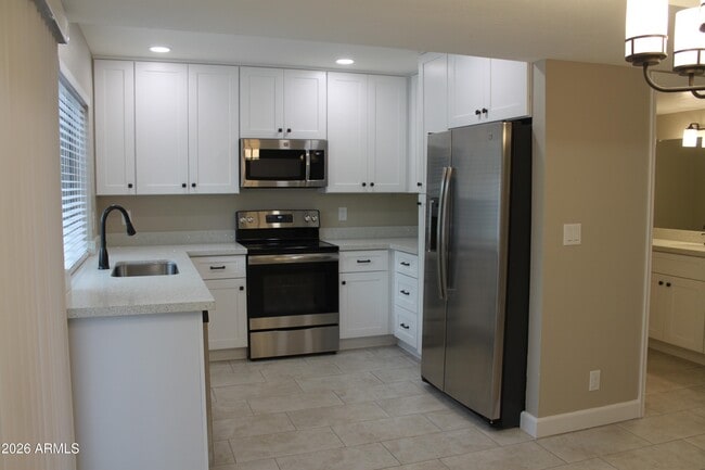 Building Photo - 1550 N Stapley Dr