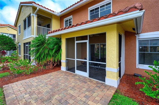 Screened in lanai, and paved patio overlooks lake - 13190 Bella Casa Cir