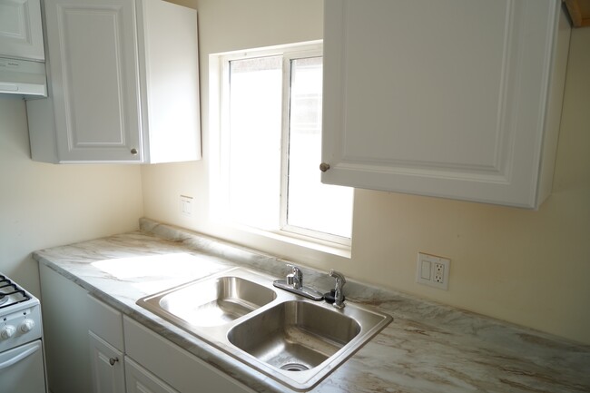 Kitchen with new cabinets and countertops - 1024 N Oxford Ave