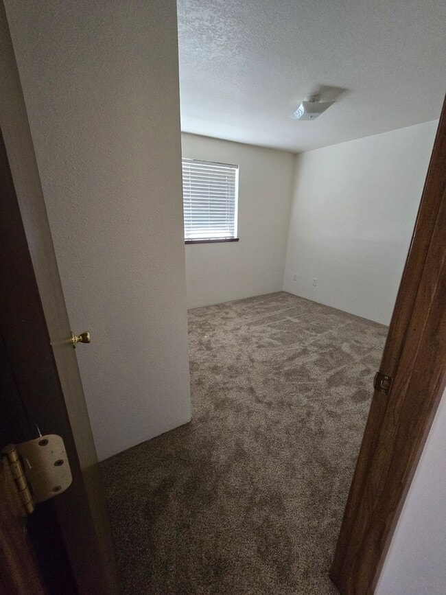 Building Photo - READY NOW. Huge backyard, lovely two bedro...