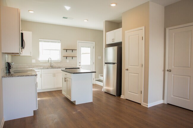 Lots of cabinet and counter space. Thoughtful upgrades including beautiful island, backsplash, etc. - 110 Kathryn Ct