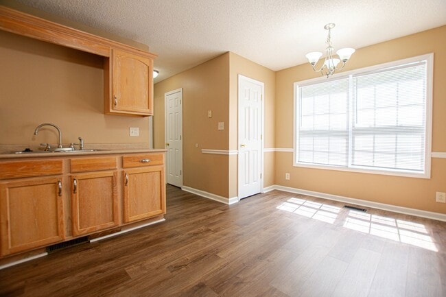Building Photo - Pet Friendly Three Bedroom with Bonus!