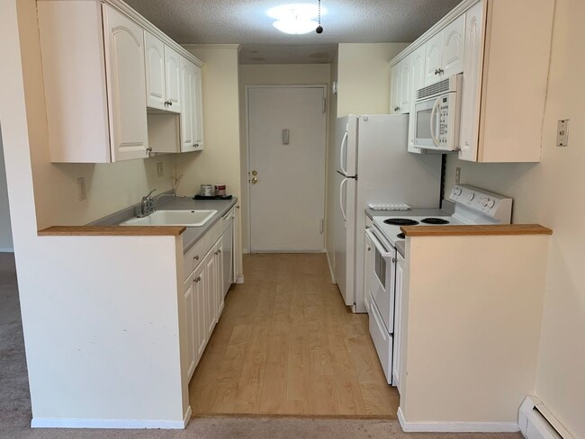 Building Photo - Upper Level Unit With Heat and Hot Water I...