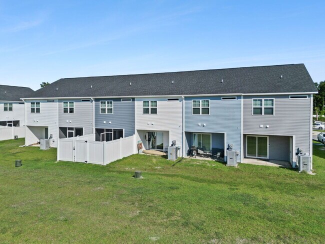 Building Photo - Available Now! Enjoy low-maintenance coastal living in this beautiful 2-bedroom, 2.5-bath townhom...