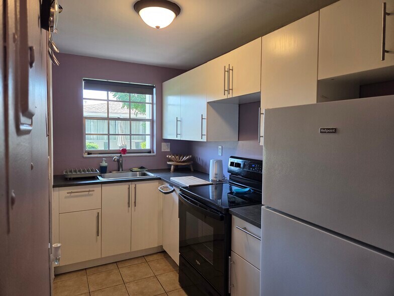 Kitchen with newer cabinets - 1965 SE 5th Ct