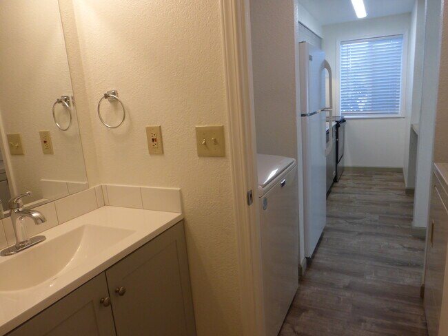Bathroom, then laundry area, and on to the kitchen - 215 8th St SE