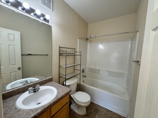 Building Photo - Home Near UNR: Spacious 4BR/4BA with Gated Access and Balcony!