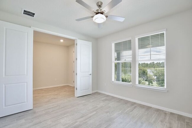 Building Photo - Modern 5/3 Water-View Home in Weslyn Park ...