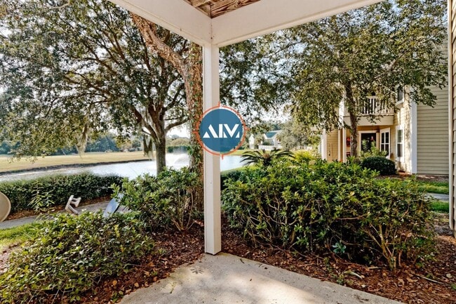 Building Photo - Charming First-Floor Condo with Pond Views at The Estate at Westbury