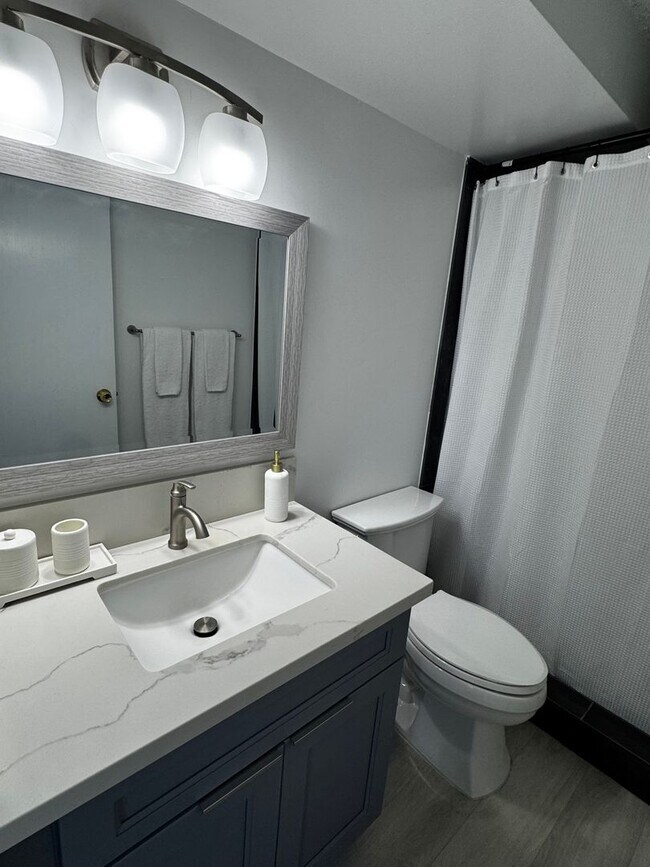 Building Photo - Upgraded Fully Furnished Condo w/ Assigned...