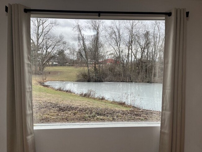 Building Photo - Charming 2-bedroom home, fully renovated and sharing 8 acres