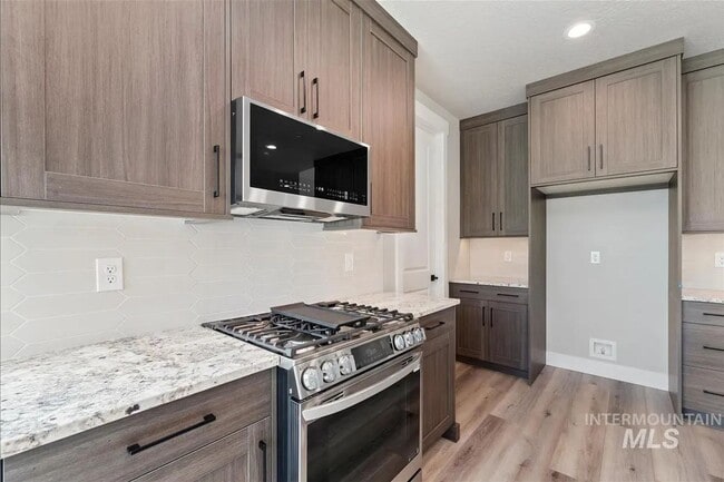 Building Photo - Brand New Spacious 4-Bedroom Home with 3-Car Garage, Granite Kitchen & Prime Middleton Location