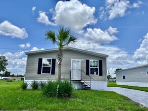 Building Photo - 6591 Hidden Oaks Dr