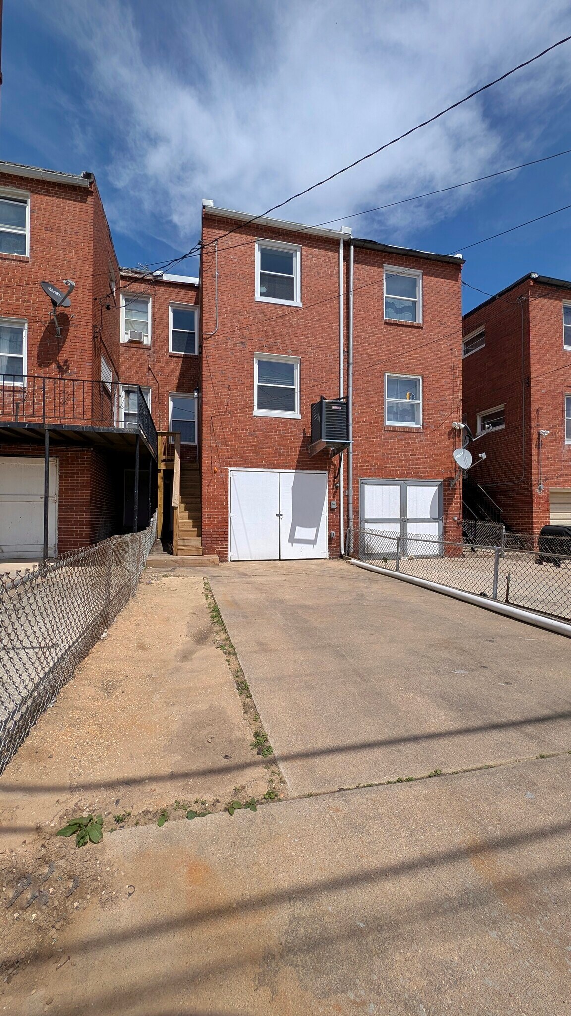 Rear yard with attached garage and parking pad - 4211 Sheldon Ave