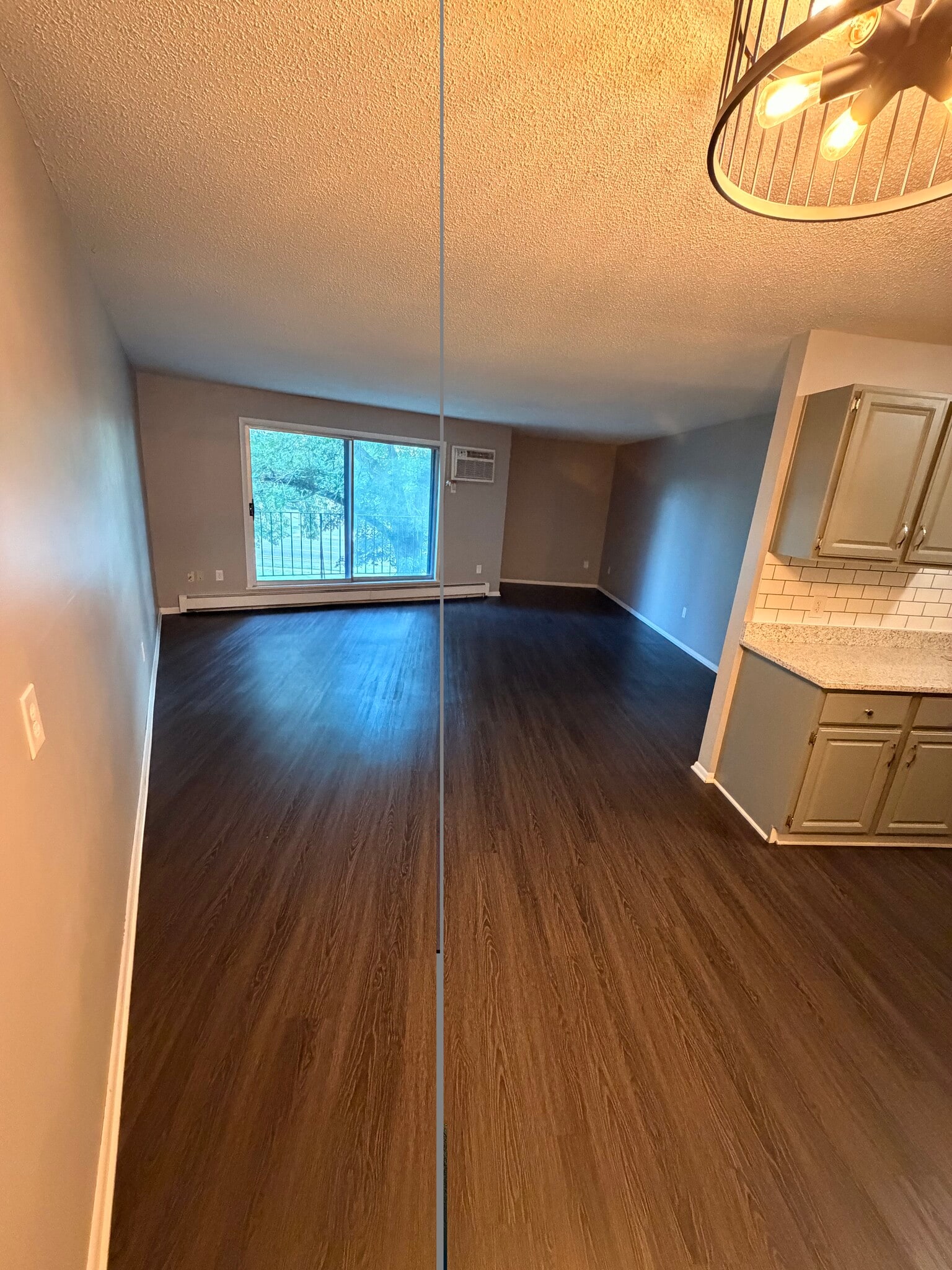 View from dining room to living room. - 8935 Old Cedar Ave S