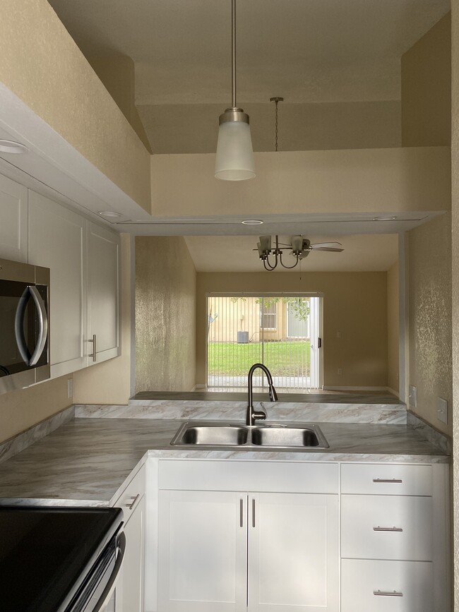 Sink and family room view - 3109 Sandy Shore Ln