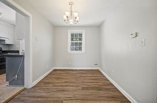 Building Photo - RARE FIND-4 BEDROOMS, 2 BATHROOMS, FENCED BACK YARD and GARAGE-PETS!!