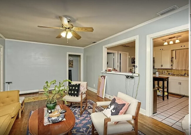 Unit A Pre-Reno Living Room with Entry to Bedroom #2 & #3 and Bathroom #2 Hallway - 4000 Crescent Dr