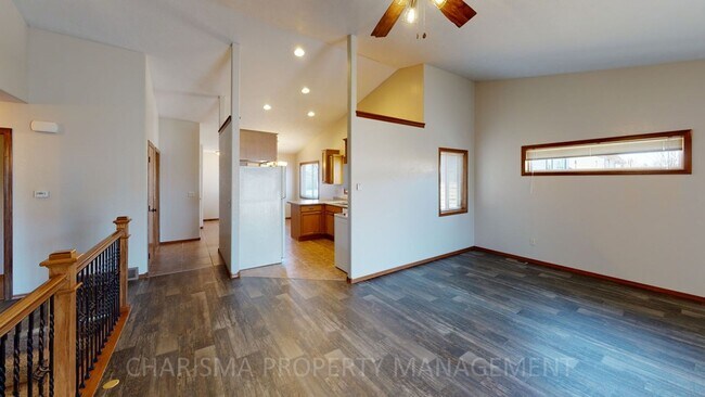 Building Photo - BEAUTIFUL & SPACIOUS 4 BD, 2 BA TOWNHOME WITH A FULLY EQUIPED KITCHEN, VAULTED CEILINGS, FIREPLAC...