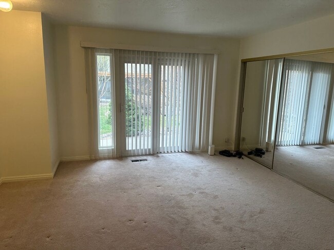 Building Photo - Spacious Millcreek Townhome with Two Living Areas, Private Deck & Community Amenities