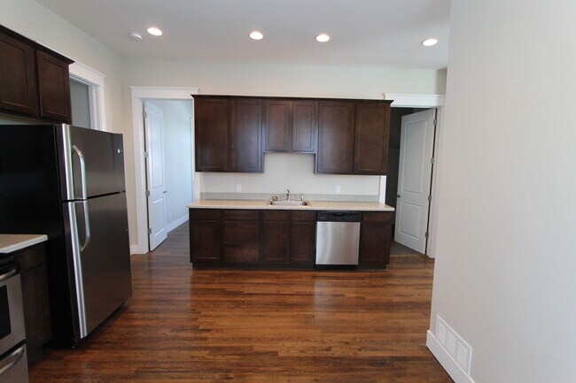 Building Photo - Midtown Renovated Duplex - Hardwood Floors, Exposed Brick