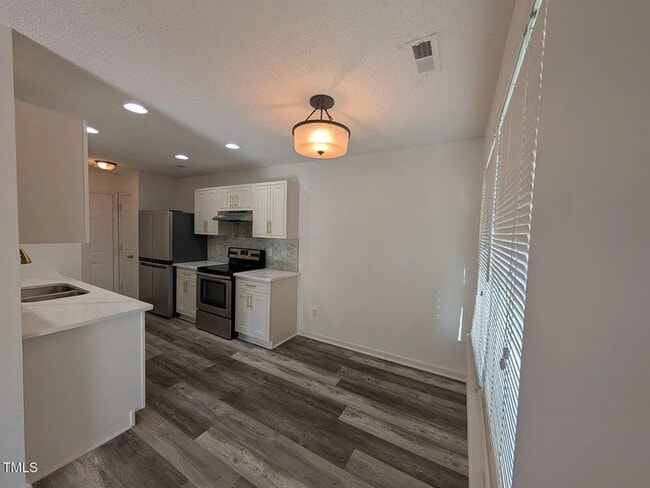 Building Photo - Earn Wealth While Leasing - Like a Homeown...