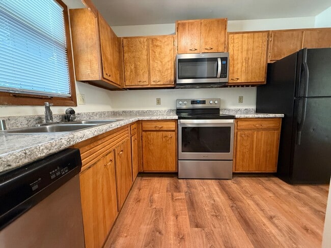 Building Photo - August 15th rent special! New deck! 3 Bedroom, updated kitchen, updated flooring, garage, drivewa...