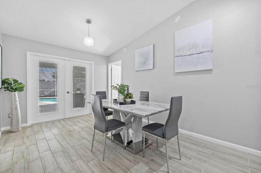 Dining area flows seamlessly into the kitchen and living spaces. - 1932 Brainerd Ct