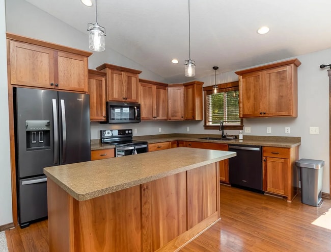 Building Photo - Modern 4BR Home with Fenced Yard + Garage ...