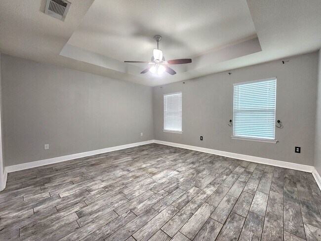 Building Photo - Welcome to your 4/2 dream home in Pace Mil...