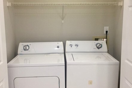 Washer and dryer inside bathroom closet - 415 Mather Green Ave