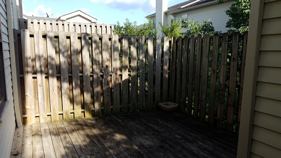 Your own deck surrounded for privacy right outside the kitchen door. - 1205 Brentwood Pt