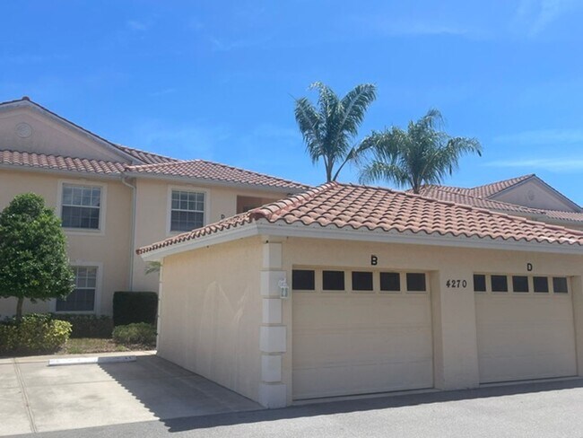 Building Photo - Elegant 3 Bedroom End-Unit Condo with Screened Lanai & Pond Views and A Private Garage