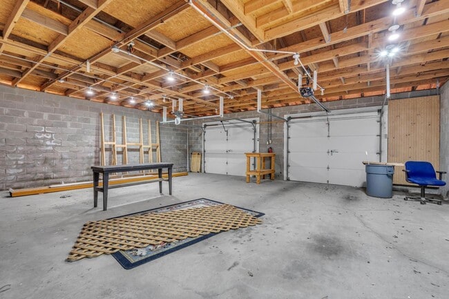 Building Photo - Charming home with large garage & attached...