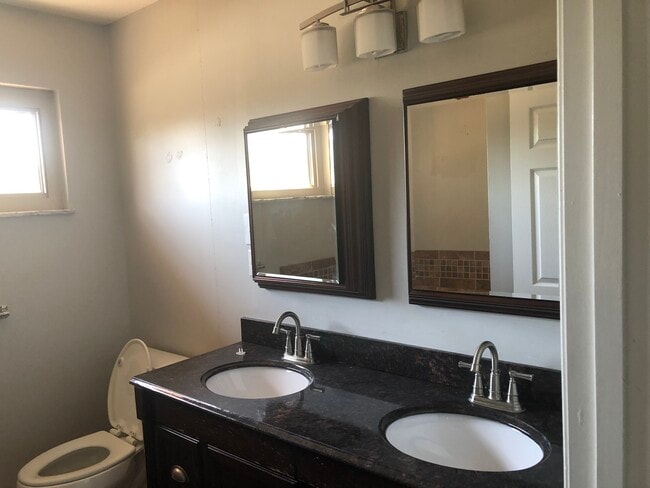 Beautiful Large Bathroom with double sink, jacuzzi tub, and shower - 302 Coronation Dr