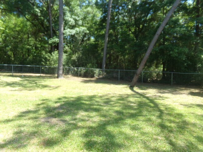Building Photo - 2BR/1BA Milton Duplex with Huge Fenced Backyard, Tile Flooring Throughout & Convenient Access to ...