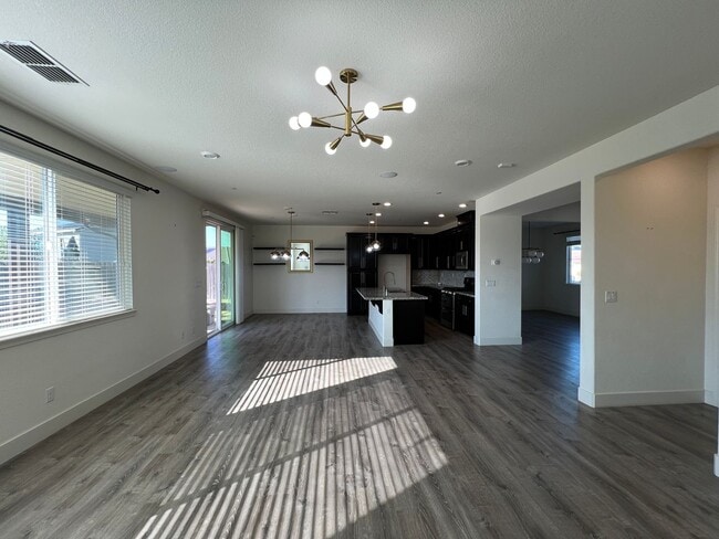 Building Photo - Beautiful 4 Bedroom Solar Home With Low Maintenance Landscaping And Updated Interior