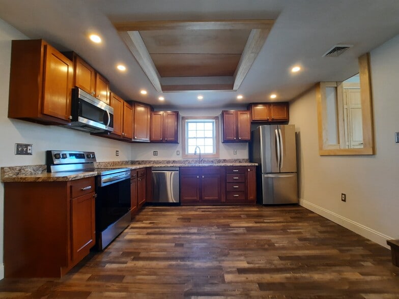 custom kitchen with all stainless steel appliances - 247 Main St