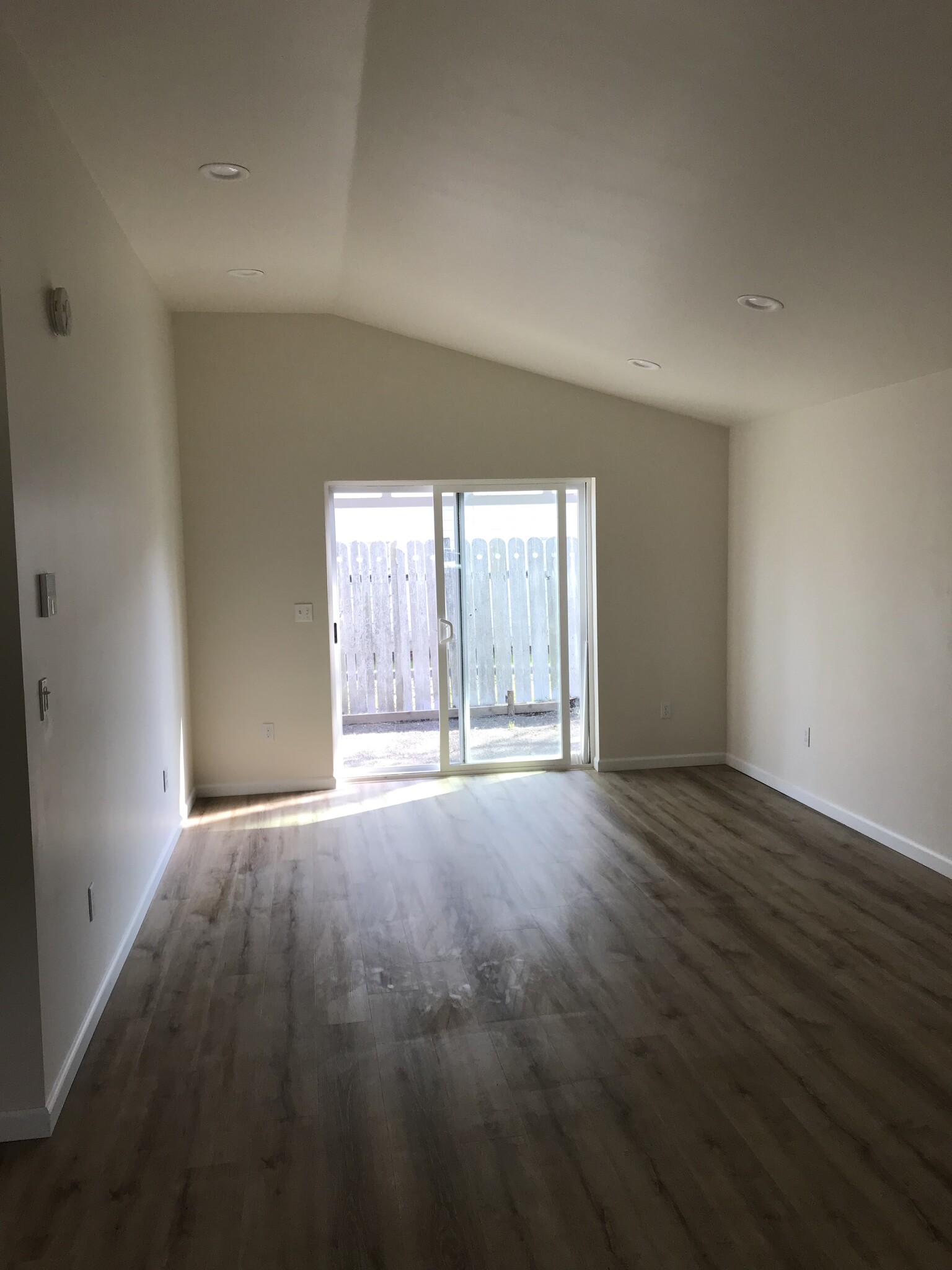 View of living room from kitchen to back patio - 224 NE Jefferson St