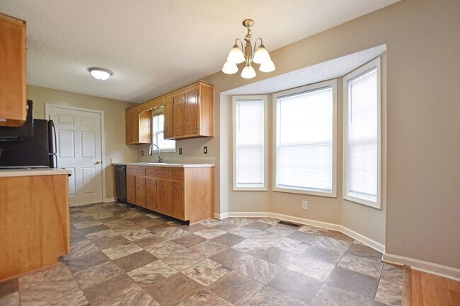 Building Photo - Pet Friendly Three Bedroom with Bonus!