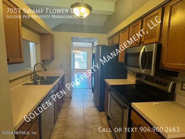 Building Photo - 7057 Swamp Flower Dr N