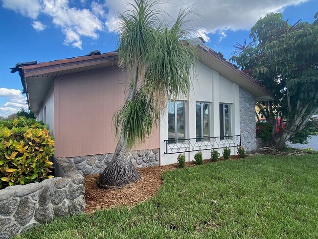 Building Photo - Updated 2-bedroom waterfront duplex with walk-in closets, enclosed Florida room, and canal views ...