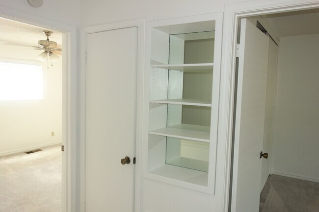 Upstairs Landing - Storage closet on left and nice mirrored built-in's on right - 3421 E 35th St